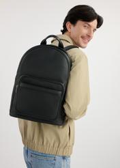 Black leather men's backpack TORMS-0450-99(W25), front product view on the model. Half of the silhouette visible.