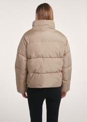 Short beige women's jacket KURDT-0601-24(Z25), product view from the back on the model. Half of the silhouette visible.