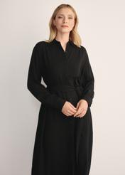 Women's black long-sleeved dress SUKDT-0246-99(Z25), front view of the product on the model. Half of the silhouette visible.