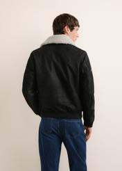 Black leather bomber jacket KURMS-0423-99(Z26), rear view on a model. Half-body shot.