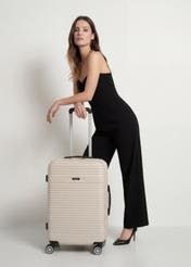 Medium suitcase on wheels WALAB-0040-0C-24(W26), product view from the front with the model, the entire silhouette visible.