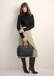 Black women's laptop bag TOREC-1351-99(Z26) - front view of the product, held by the model, against a light background. The entire silhouette is visible.