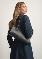 Black leather oblong women's handbag TORES-1259-99(W26) - diagonal view of the product, on a model, on a white background.