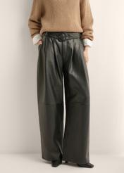 Women's wide-leg black leather trousers SPODS-0050-99(Z26), front view of the product on the model. Half of the silhouette visible.