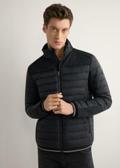 Men's black transitional jacket KURMT-0358A-99(W26) - front view of the product, on a model, against a light background. Half of the silhouette visible.