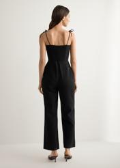 Women's black jumpsuit KOBDT-0011-99(W26), back view of the product on the model. Full body visible.