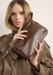 Brown women's shoulder bag TOREC-1245-1H(Z26), view of the product in the model's hands, on a light background.