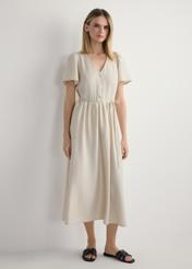 Women's light beige dress SUKDT-0255-1A(W26), front view of the product on the model. Full body visible.