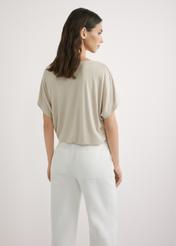 Light beige women's blouse BLUDT-0202-1A(W26), back view of the product on the model. Half of the silhouette visible.