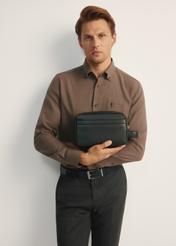 Black leather men's cosmetic bag TORMS-0473-99(Z25), front view of the product on the model, half of the silhouette visible.