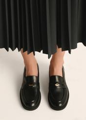 Women's black leather moccasins with logo BUTYD-1199-99(Z25) - top view of the product on a model on a white background.