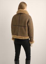 Women's brown short sheepskin coat KOZDP-0017-1H(Z26), back view of the product on the model. Full body visible.