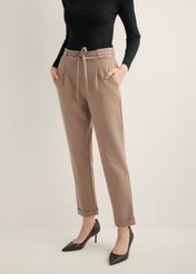 Women's trousers with a crease in a cool beige color SPODT-0098-1K(Z26), front view of the product on the model, half of the silhouette visible.
