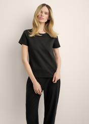 Women's black cotton t-shirt TSHDT-0144-99(Z25), front view of the product on the model. Half of the silhouette visible.