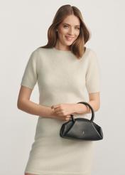 Black mini top handle bag TORES-1203-99(Z25) - front view of the product on a model against a white background. Half of the silhouette visible.