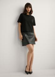 Short black leather skirt SPCDS-0082-99(W26), front view of the product on the model. Full body visible.