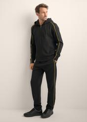 Men's black sweatpants SPOMT-0127-99(Z26), diagonal view of the product on the model. Full body visible.