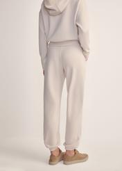 Light beige women's trousers SPODT-0117-80(Z25), back view of the product on the model. Half of the silhouette visible.
