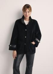 Women's wool fur coat in black FUTDW-0032-99(Z25) - front view of the product on a model on a white background. Half of the silhouette visible.