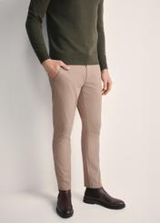 Beige men's trousers SPOMT-0103A-24(Z25), front view of the product on the model. Half of the silhouette visible.