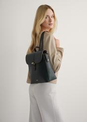 Women's black backpack TOREC-1198-99(W26), product view on model's back. Half of silhouette visible.