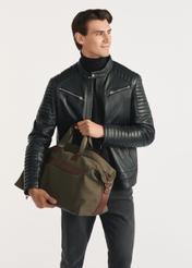 Khaki TORMN-0372-55(Z25) travel bag - product view on model, on white background. Knee-length silhouette visible.