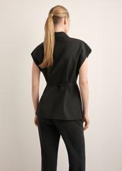 Women's black oversize suit vest KAMDT-0039-99(Z26), back view of the product on the model. Half of the silhouette visible.
