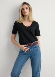 Women's black cotton T-shirt TSHDT-0151-99(W26), front view of the product on the model. Half of the silhouette visible.