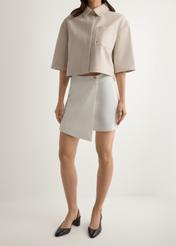 Women's white culottes SZODT-0008-0B(W26), front view of the product on the model. Half of the silhouette visible.