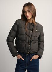 Black women's short jacket KURDT-0621-99(W26), front view of the product on the model. Half of the silhouette visible.