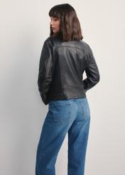 Dark brown women's leather jacket KURDS-0563-2729(Z25), back view of the product on the model. Half of the silhouette visible.