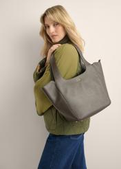 Women's dark brown leather shopper bag TORES-1340-1I(Z26), front view of the product on a model. Half of the silhouette visible.