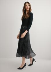 Pleated midi skirt with polka dots SPCDT-0110-9P(W26), product view from the side on the model, the whole silhouette is visible.