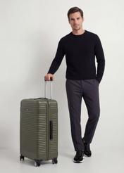 Large suitcase on wheels WALAB-0040-8D-28(W26), product view diagonally next to the model, the entire silhouette is visible.