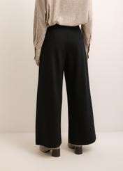 Black women's wide leg trousers SPODT-0130-99(Z26), back view of the product on the model. Half of the silhouette visible.