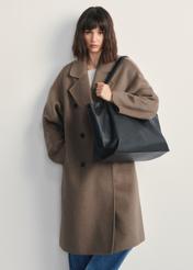 Large black leather women's handbag TORES-1181-99(Z25) - front view of the product on a model against a white background. Full body visible.