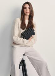 Black leather women's handbag TORES-1036D-99(Z25), front view of the product on a model, half of the silhouette visible.