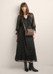 Brown women's shoulder bag TOREC-1063-1H(Z26), diagonal view of the product on the model. Full body visible.
