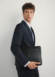 Black leather laptop briefcase TORMS-0455-99(W25), front view of the product on the model, half of the silhouette visible.