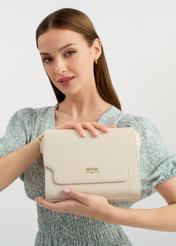 Cream women's messenger bag TOREC-0899A-12(W25) - front view on a model holding the bag. Half of the silhouette visible.