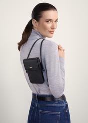 Women's quilted pouch TOREC-1113-99(Z25), front view of the product on a model, half of the silhouette visible.