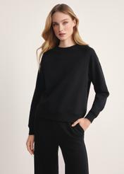 Black women's sweatshirt BLZDT-0114-99(Z25), product visible from the front on the model, half of the silhouette visible.