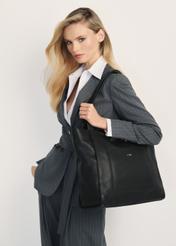 Black leather women's handbag TORES-1144-99(Z25) - product view on a model on a white background. Half of the silhouette visible.
