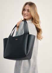 Black classic women's shopper bag TOREC-1060-99(Z25) - diagonal view of the product on a model, against a white background. Half of the silhouette is visible from the side.