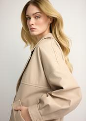 Beige oversize women's leather jacket KURDS-0577-1B(W26) - side view of the product, on a model, against a light background. Half of the silhouette visible.