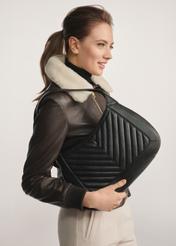 Women's leather shoulder bag TORES-1194-99(Z25) - front view of the product on a model against a white background. Half of the silhouette visible from the side.