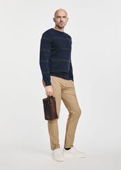 Men's brown leather cosmetic bag TORMS-0106-1H(W26), view of the product in the model's hand, on a light background.