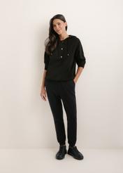 Women's black trousers SPODT-0108-99(W26), front view of the product on the model. The entire silhouette is visible.