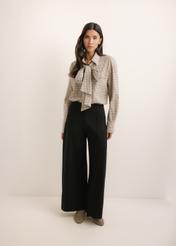 Black women's wide leg trousers SPODT-0130-99(Z26), front view of the product on the model. The entire silhouette is visible.