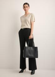 Black leather shopper bag TORES-1342-9I(Z26), product view in model's hand. Full body visible.